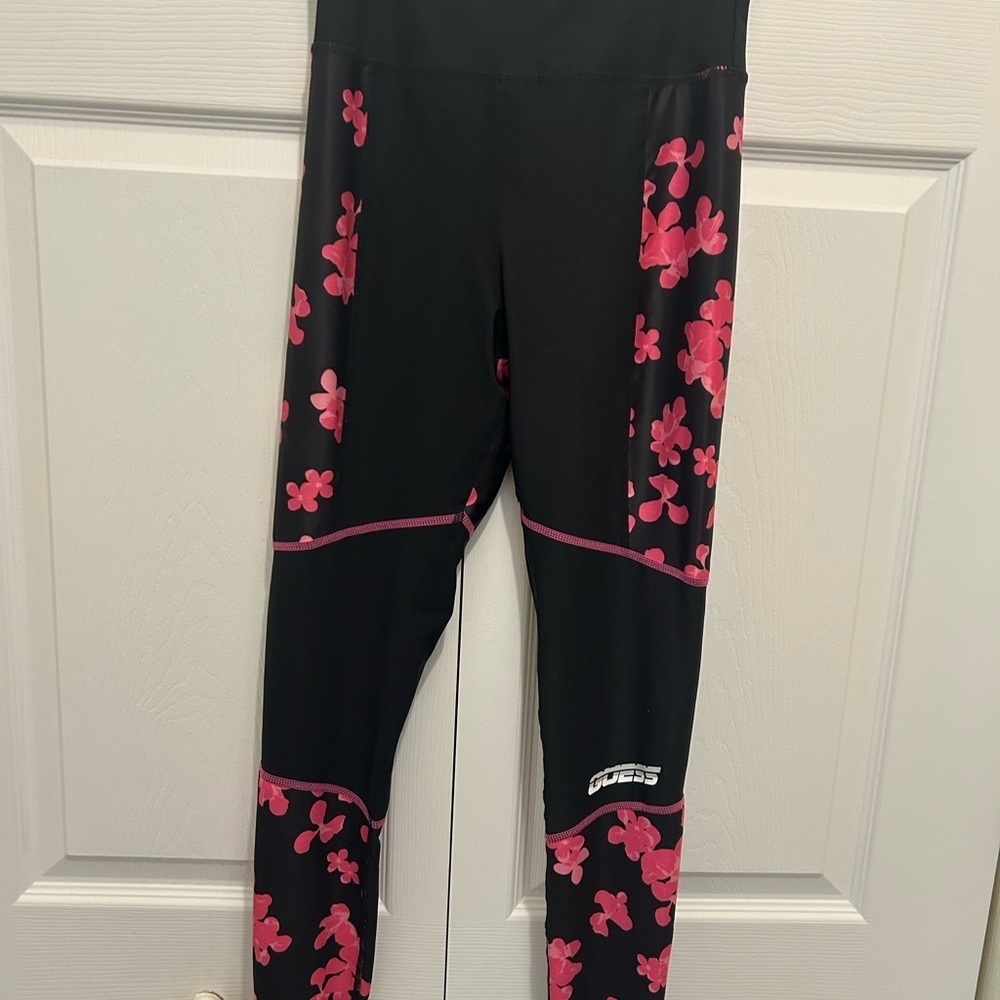 Guess Women athletic Black Leggings with Pink Floral Accents. Size X small.